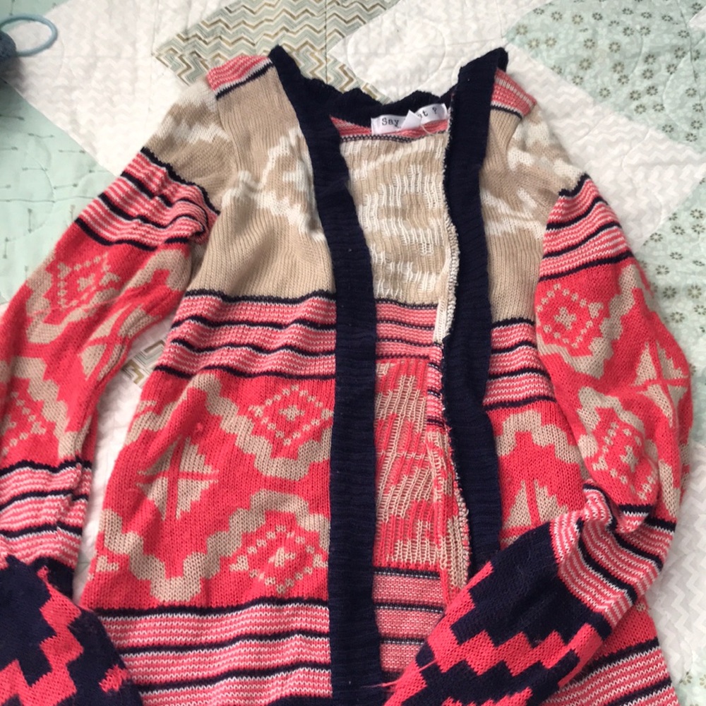 Longer cardigan, covers butt